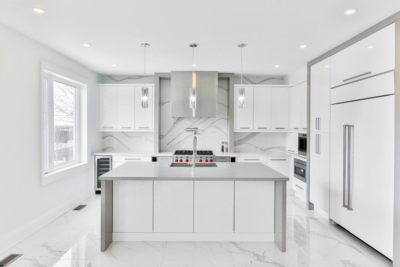 Custom kitchen remodel in St. Petersburg with full-height cabinetry and stone worktops