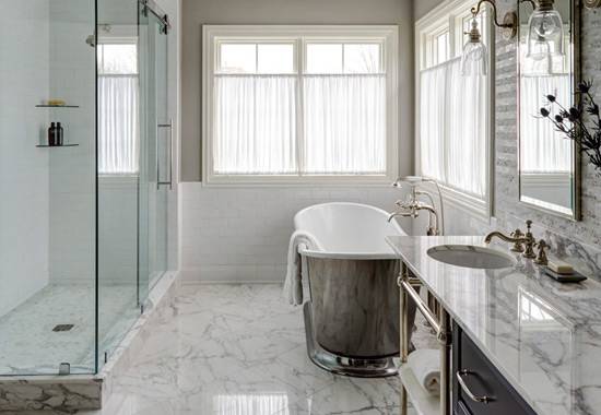 Renovated bathroom with a tiled walk-in shower, glass screen and modern vanity